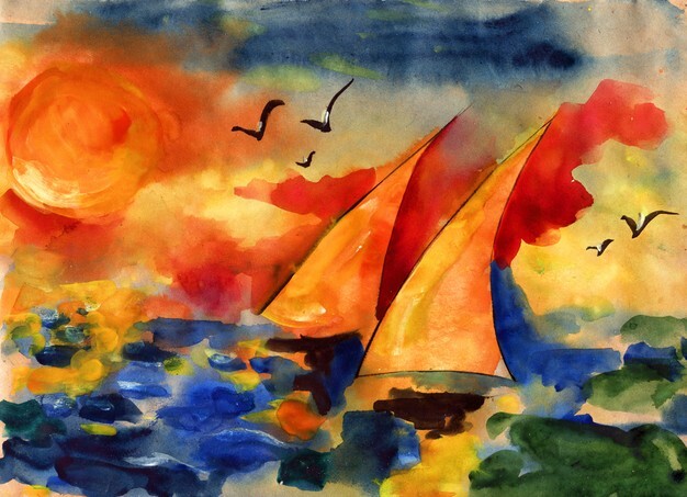 Yellow sails on the sea set against the setting sun sky